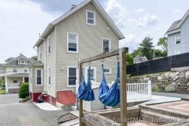 25 Myrtle Ave, Ansonia, CT 06401 - rear view of house featuring a wooden deck