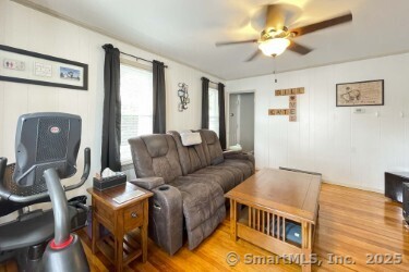 25 Myrtle Ave, Ansonia, CT 06401 - living room featuring a ceiling fan and wood finished floors