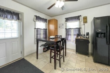 25 Myrtle Ave, Ansonia, CT 06401 - dining space with a ceiling fan, plenty of natural light, an office area, and light tile patterned floors