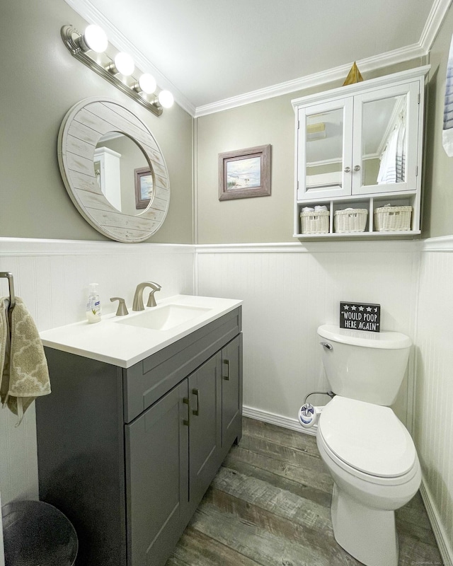 25 Myrtle Ave, Ansonia, CT 06401 - bathroom with vanity, toilet, wood finished floors, wainscoting, and crown molding