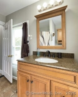 25 Myrtle Ave, Ansonia, CT 06401 - full bath featuring vanity and tile patterned flooring
