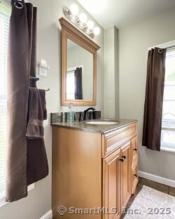 25 Myrtle Ave, Ansonia, CT 06401 - bathroom with baseboards and vanity