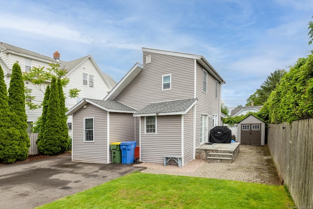 86 Chambers St, Waterbury, CT 06708 - back of house with a shingled roof and a patio area