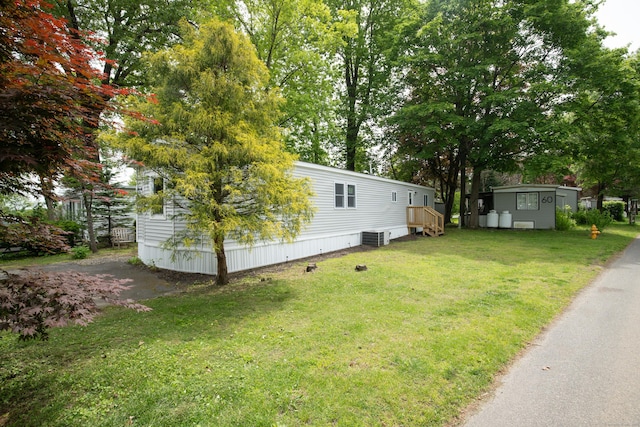 45 Twin Oaks Ln, Danbury, CT 06810 - view of grassy yard featuring an outdoor structure and cooling unit