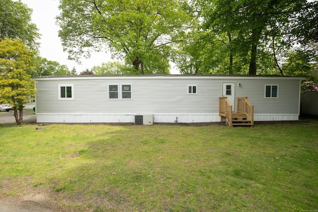 45 Twin Oaks Ln, Danbury, CT 06810 - back of house featuring a yard and cooling unit