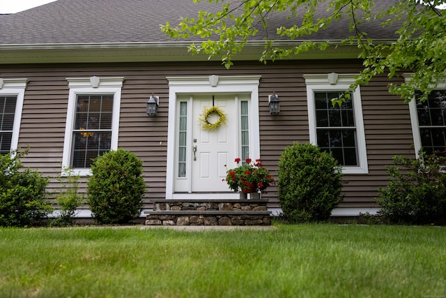 116 Case St, Canton, CT 06019 - property entrance featuring roof with shingles and a yard