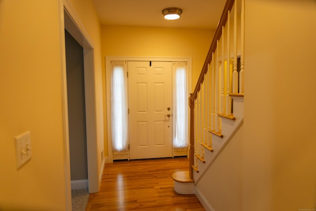 116 Case St, Canton, CT 06019 - foyer with stairway, baseboards, and wood finished floors