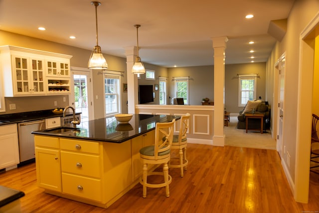116 Case St, Canton, CT 06019 - kitchen featuring dishwasher, a sink, dark countertops, light wood-style flooring, and recessed lighting