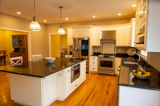 116 Case St, Canton, CT 06019 - kitchen featuring stainless steel appliances, a sink, dark countertops, range hood, and white cabinetry