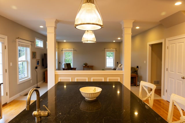 116 Case St, Canton, CT 06019 - dining space with decorative columns, light wood-type flooring, and recessed lighting