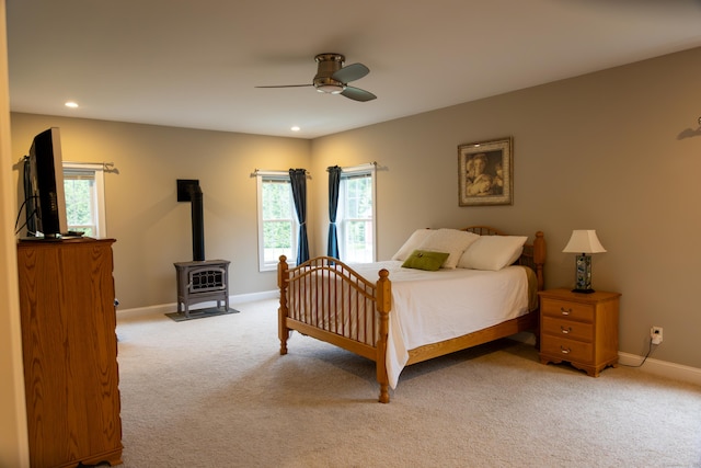 116 Case St, Canton, CT 06019 - bedroom featuring light colored carpet, a wood stove, baseboards, a ceiling fan, and recessed lighting