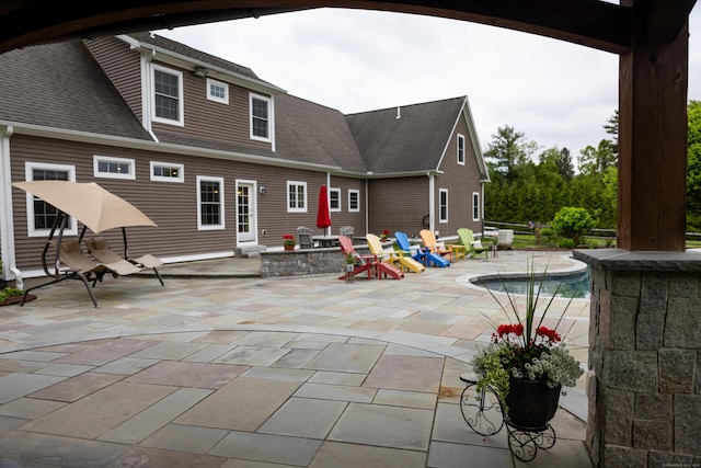 116 Case St, Canton, CT 06019 - back of house with an outdoor pool, roof with shingles, and a patio