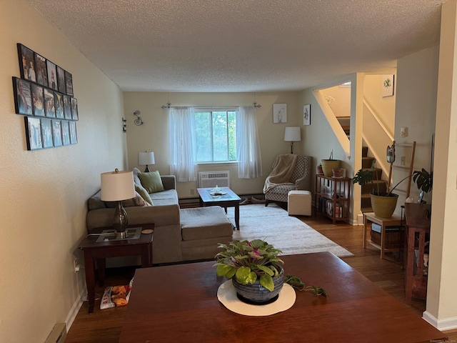925 Oronoke Rd Unit 26F, Waterbury, CT 06708 - living area with dark wood-style flooring, stairway, a textured ceiling, a baseboard radiator, and baseboards