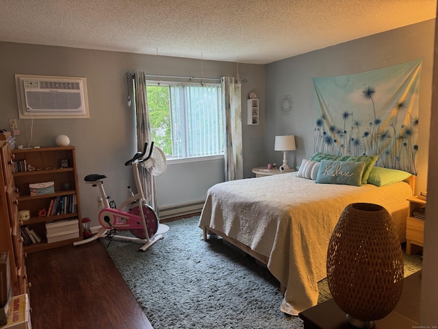 925 Oronoke Rd Unit 26F, Waterbury, CT 06708 - bedroom featuring a wall mounted air conditioner, a baseboard heating unit, a textured ceiling, and wood finished floors