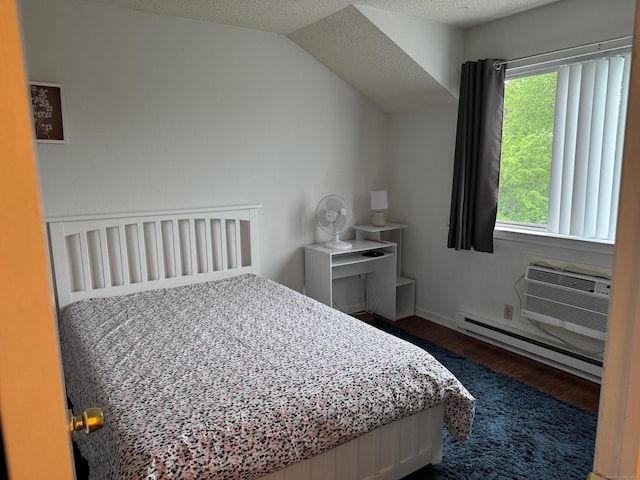 925 Oronoke Rd Unit 26F, Waterbury, CT 06708 - bedroom featuring a baseboard radiator, dark wood-type flooring, and a wall mounted air conditioner