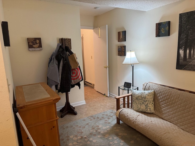 925 Oronoke Rd Unit 26F, Waterbury, CT 06708 - living area featuring a baseboard heating unit and light tile patterned floors