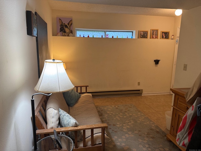 925 Oronoke Rd Unit 26F, Waterbury, CT 06708 - living area with tile patterned flooring and a baseboard heating unit