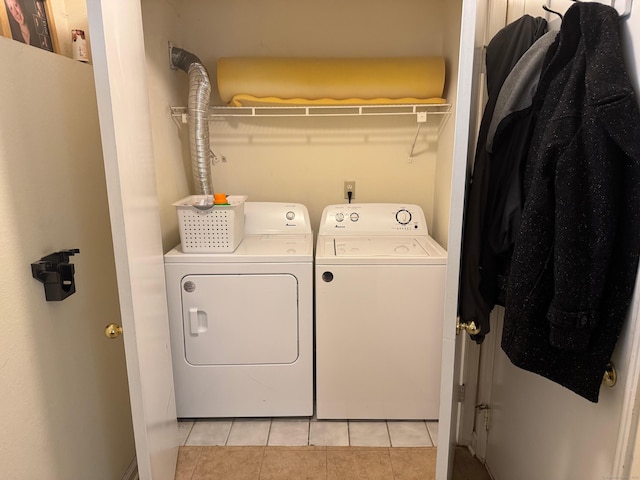 925 Oronoke Rd Unit 26F, Waterbury, CT 06708 - laundry area with washer and dryer and light tile patterned flooring
