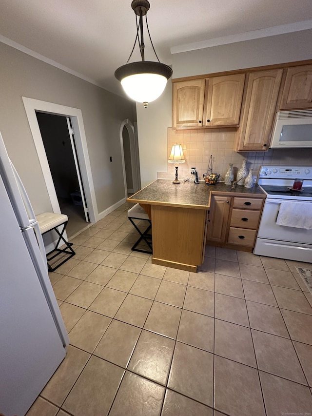 18 New St, Ansonia, CT 06401 - kitchen with white appliances, light tile patterned floors, a peninsula, decorative backsplash, and arched walkways
