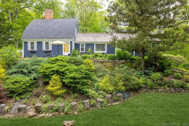 286 Limestone Rd, Ridgefield, CT 06877 - view of front of house featuring a chimney, roof with shingles, and a front lawn