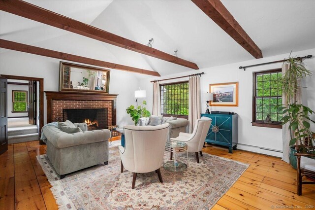 286 Limestone Rd, Ridgefield, CT 06877 - living area with a baseboard heating unit, healthy amount of natural light, hardwood / wood-style floors, and a fireplace