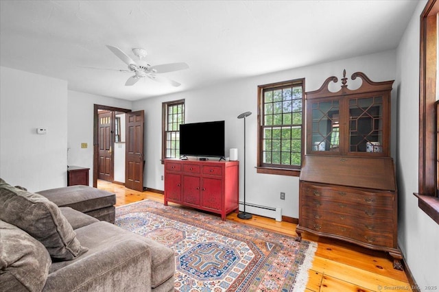 286 Limestone Rd, Ridgefield, CT 06877 - living room featuring baseboard heating, a ceiling fan, light wood finished floors, and baseboards