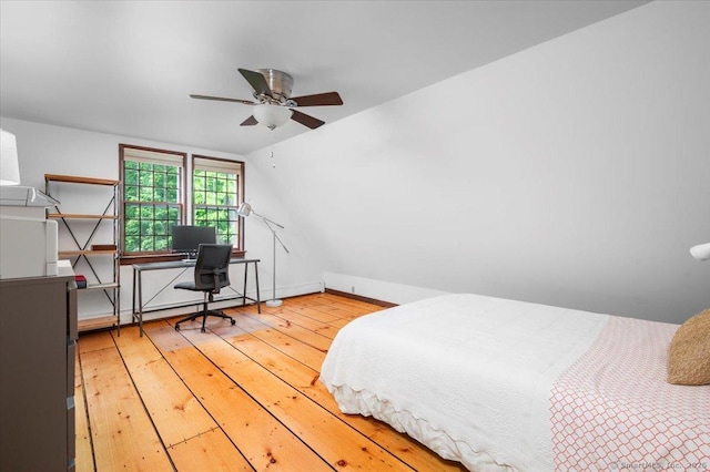 286 Limestone Rd, Ridgefield, CT 06877 - bedroom with wood-type flooring, an office area, baseboards, and vaulted ceiling