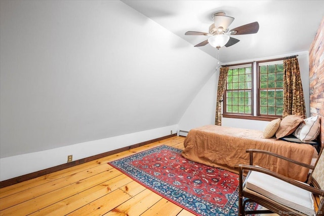 286 Limestone Rd, Ridgefield, CT 06877 - bedroom with lofted ceiling, hardwood / wood-style flooring, a baseboard radiator, and a ceiling fan
