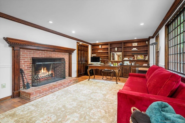 286 Limestone Rd, Ridgefield, CT 06877 - living room featuring ornamental molding, wood finished floors, a brick fireplace, built in shelves, and recessed lighting