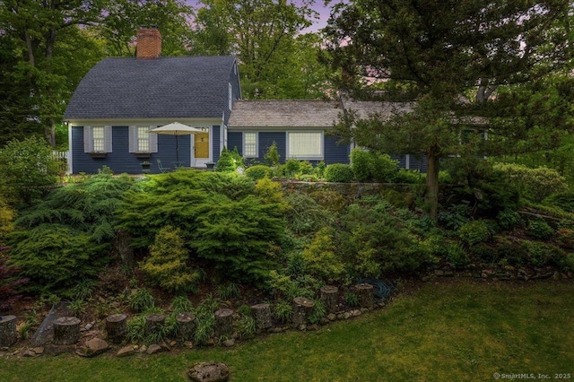 286 Limestone Rd, Ridgefield, CT 06877 - view of front facade with a chimney, a shingled roof, and a front lawn
