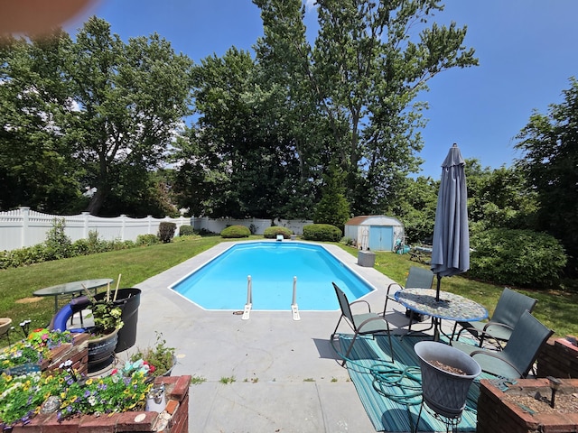 13 Harkness Dr, Milford, CT 06460 - view of swimming pool featuring a shed, a patio, and a fenced backyard