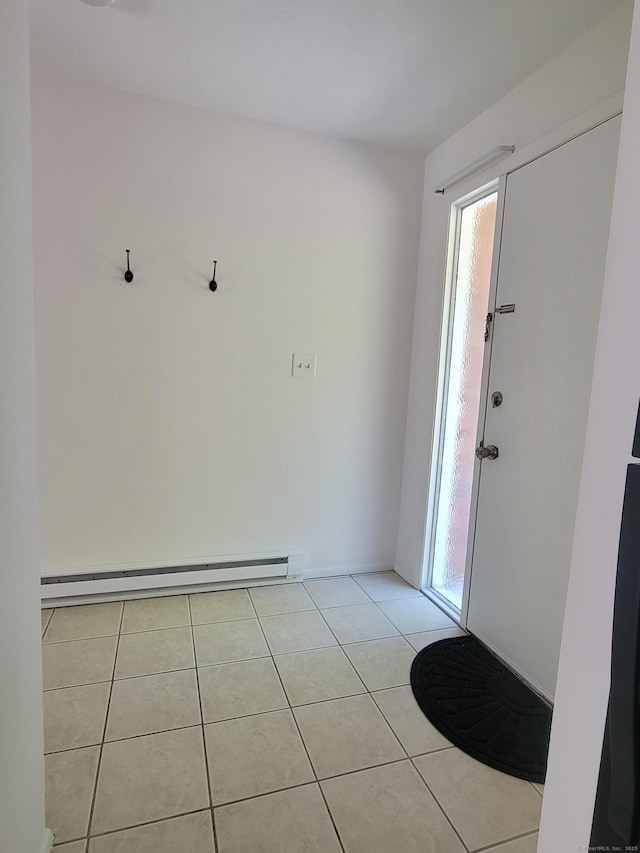 213 Baxter Rd Apt D, Mansfield, CT 06268 - entrance foyer with light tile patterned floors, healthy amount of natural light, and a baseboard radiator