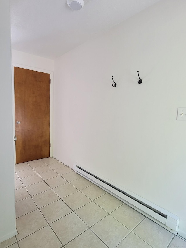213 Baxter Rd Apt D, Mansfield, CT 06268 - empty room featuring a baseboard radiator and light tile patterned flooring