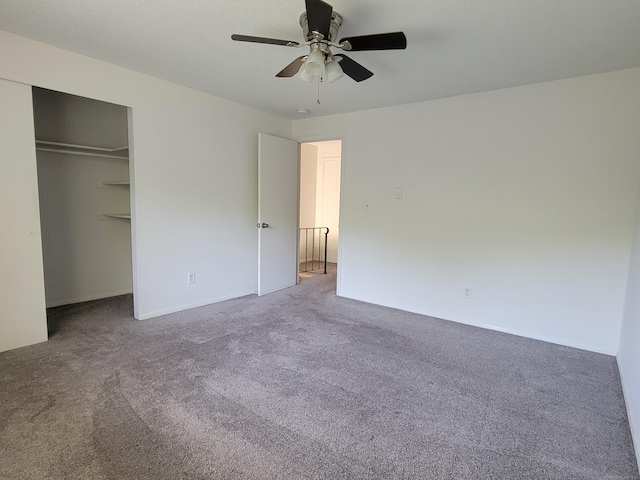 213 Baxter Rd Apt D, Mansfield, CT 06268 - unfurnished bedroom with carpet flooring, a closet, and a ceiling fan