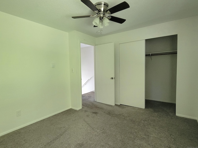 213 Baxter Rd Apt D, Mansfield, CT 06268 - unfurnished bedroom featuring carpet flooring, a closet, a ceiling fan, and baseboards