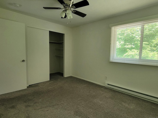 213 Baxter Rd Apt D, Mansfield, CT 06268 - unfurnished bedroom featuring baseboard heating, dark colored carpet, a closet, and ceiling fan