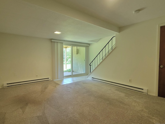 213 Baxter Rd Apt D, Mansfield, CT 06268 - unfurnished living room with baseboard heating, carpet, and stairs