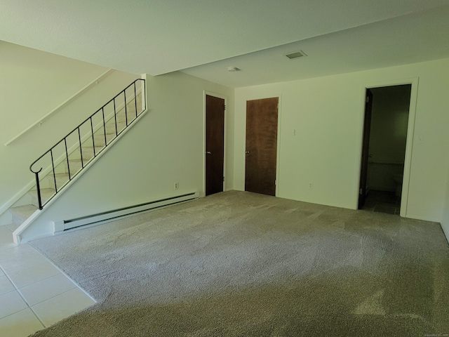 213 Baxter Rd Apt D, Mansfield, CT 06268 - unfurnished living room featuring baseboard heating, stairway, carpet flooring, and tile patterned flooring