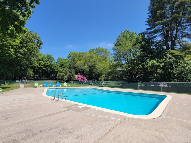 213 Baxter Rd Apt D, Mansfield, CT 06268 - community pool with a patio area and view of scattered trees
