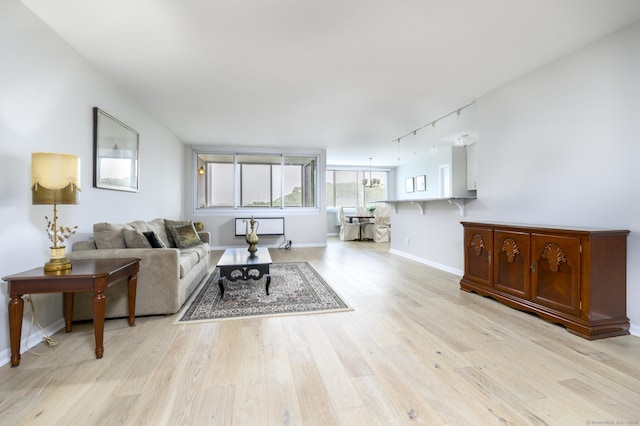 1 Strawberry Hill Ave Apt 7A, Stamford, CT 06902 - living room with rail lighting and light wood-style flooring