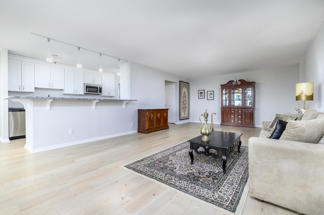 1 Strawberry Hill Ave Apt 7A, Stamford, CT 06902 - living room with track lighting and light wood finished floors
