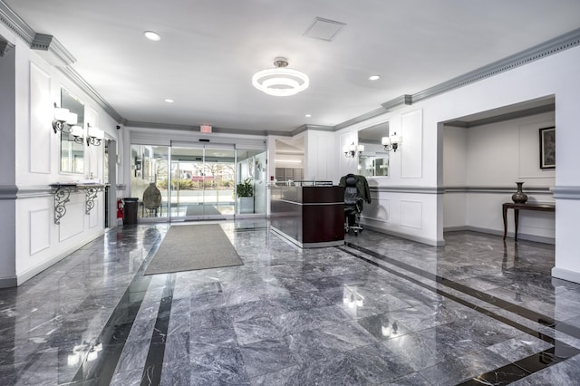 1 Strawberry Hill Ave Apt 7A, Stamford, CT 06902 - building lobby with a decorative wall, crown molding, and recessed lighting