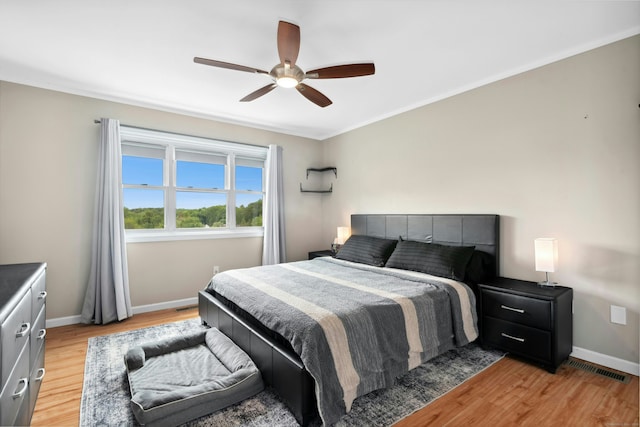 173 Russo Ave Unit 406, East Haven, CT 06513 - bedroom with baseboards, light wood-style floors, ceiling fan, and crown molding