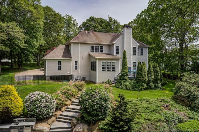 41 Leeward Ln, Groton, CT 06340 - rear view of property with stairs, a chimney, and view of scattered trees