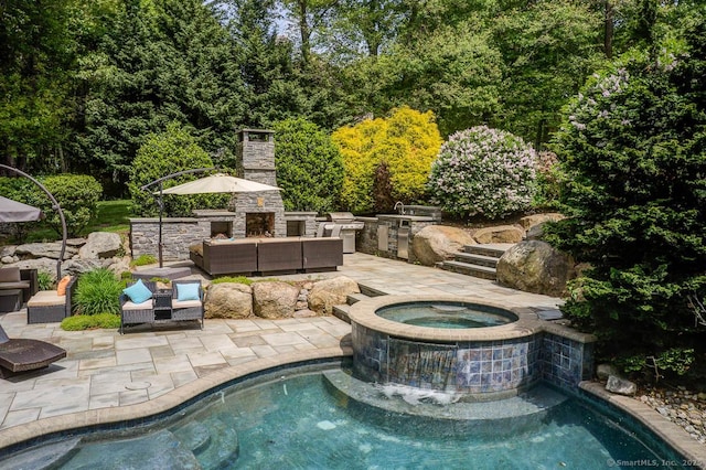 41 Leeward Ln, Groton, CT 06340 - view of pool featuring an outdoor living space with a fireplace, a patio, a pool with connected hot tub, and exterior kitchen