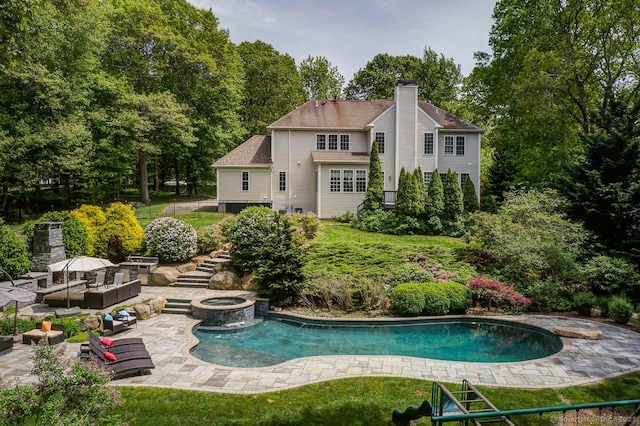 41 Leeward Ln, Groton, CT 06340 - outdoor pool with a patio, stairway, view of wooded area, outdoor lounge area, and an in-ground hot tub