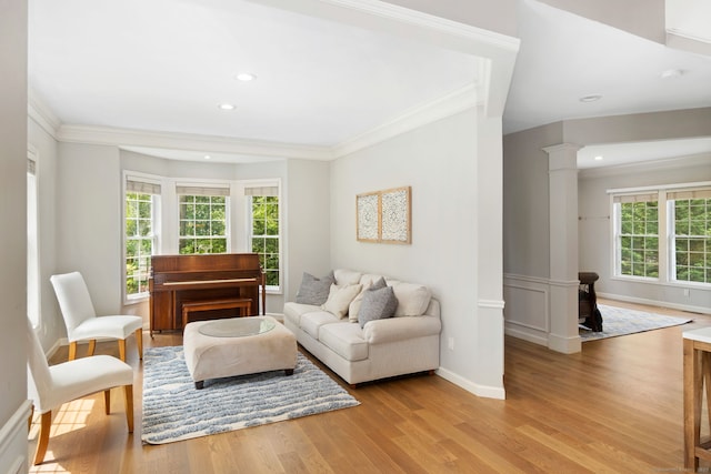 41 Leeward Ln, Groton, CT 06340 - living area featuring crown molding, plenty of natural light, wood finished floors, recessed lighting, and ornate columns