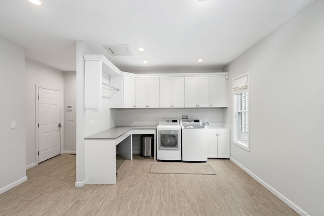 41 Leeward Ln, Groton, CT 06340 - washroom featuring cabinet space, washer and dryer, baseboards, recessed lighting, and light wood-type flooring