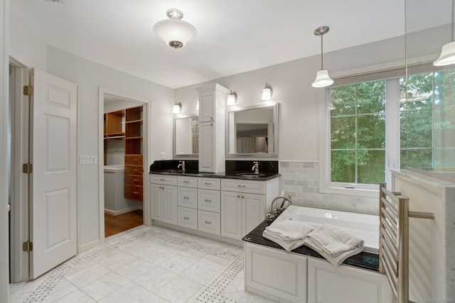 41 Leeward Ln, Groton, CT 06340 - bathroom featuring double vanity and a garden tub