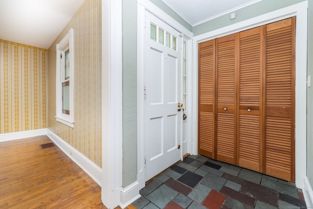 127 Matson Hill Rd, Glastonbury, CT 06073 - foyer entrance with wallpapered walls, crown molding, baseboards, and wood finished floors